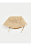 Beige baby boy bucket hat from gulis clothing