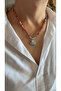 قلادة من اللؤلؤ مع طرف المحار