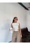 Sleeveless White Draped Blouse with Accessories