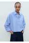 Pocketed shirt with a wide cut