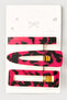 مجموعة من 3 مشابك جانبية منقوشة باللون الوردي والأسود