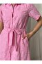 Belted, beaded design, maxi-length wrap dress, comfortable and stylish for everyday wear.