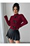 knitted sweater with braided bow detail