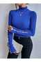 turtleneck knit sweater with pearl-embroidered sleeves and necklace detail