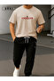 Conquer the World Printed Oversize Beige T-Shirt & Black Pants Tracksuit Set