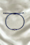 Adjustable String Bracelet with Evil Eye Bead and Eye Figure - Does Not Tarnish