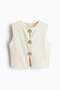 Button-decorated top
