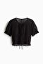 Cropped pointelle-knit top