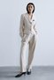 Melanj Textured Beige Pleated Trousers