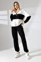 Hooded two-piece suit with elastic waist and zip cuffs - 7