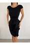 A Glamorous Invitation Dress That Combines a Classic Cut with Bold and Dynamic Ruffle Details 58256