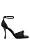 Woman. Black Satin Heeled Shoes