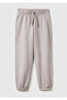 Girl's beige elastic waist drawstring joggers with elastic cuffs