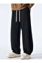 Men's Black Comfortable Fit Trackpants with Wide Legs and Stretchy Fabric - 2