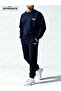 The Hoodless, Navy Blue Tracksuit Is Designed with Original Prints. - 4