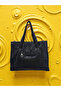 The woman carries an imported bag on her shoulder. - 2