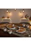 A luxurious Ramadan hospitality set consisting of 12 pristine white ceramic coffee cups and two serving saucers. - 6