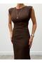 Brown sleeveless maxi dress with lace detail at the waist