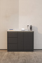 A modern coffee corner in black, suitable for small spaces.