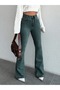 GREEN TINTED FLARED-LEG JEANS