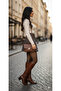 Brown plaid pleated skirt with belt loops, side zipper, and built-in shorts. - 2