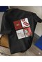 T-Shirt with a Collage Design Featuring Red Lips, Cars, Letters and Other Elements That Are Eye-Catching.