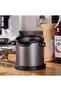 A tool (container) for collecting used black coffee from a jar. - 3