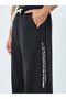 Men Black Minimal Print Relaxed Fit Joggers - 4