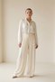 Cream wide cut trousers with waist adjustment