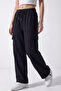Women's Black Oversize Parachute Fabric Cargo Pants with Pockets, Adjustable Leg Clips, Baggy Pants