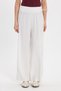 Women's relaxed fit white trousers with elastic waistband