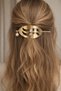 Metal Hair Clip with Pearls – Stylish Wave Design