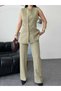 Stylish and Modern Two-Piece Set Featuring Gold Button Details, a Sleeveless Long Vest, and High-Waisted Pants. - 5