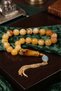 Gold Silver Tasseled Mascot Rock Drop Amber Prayer Beads - 4
