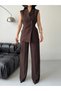 Stylish and Modern Two-Piece Set Featuring a Sleeveless Long Vest and High-Waisted Pants.