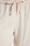 Women's relaxed fit 100% cotton stone washed trousers with drawstring waist, elasticated waistband, double pockets, and a two-thread construction. - 5
