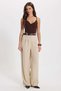 Women's relaxed fit beige trousers with gold button detail and double pockets - 6