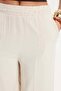 Women's relaxed fit soft-touch stone washed jeans with elastic waistband and double pockets. - 4