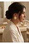 Earrings - Gold Steel Earrings with Pearl White Minela Around Them and Half Sun Detail on the Inside