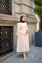 Women's Skirt with Ruffles and Stone Button Detail Set in Cream - 2
