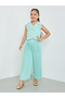 Girls Green Sleeveless Waistcoat And Pleated Trousers Set