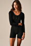 Totjun Women's Soft and Flexible Fabric Short Black Jumpsuit with Hollow Out Collar and Buttons - 3