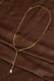Gold Y Necklace with Carousel Figure
