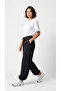 Women's Black Oversize Parachute Fabric Slim Trousers with Cargo Pockets, Comfortable Fit Baggy with Adjustable Leg Clips - 6