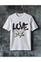 تي شيرت كبير الحجم مطبوع عليه love and style zincir