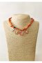 Orange Patterned Fabric Necklace with Flower Charm Detail