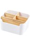Bamboo desktop storage box with multiple compartments for storing pens and accessories.