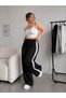 Women's Baggy Pants with Ribbed Cuffs and Striped Details - 3