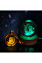 Color Changing Glass Globe and Keychain Set with Astronaut Design Sitting on the Moon