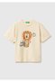 Boy's cream-colored crew neck t-shirt with print and appliqué details